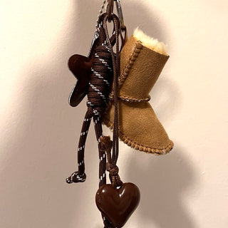 
                    
                      Taschen Schluessel Anhaenger Fellstiefel
                    
                  